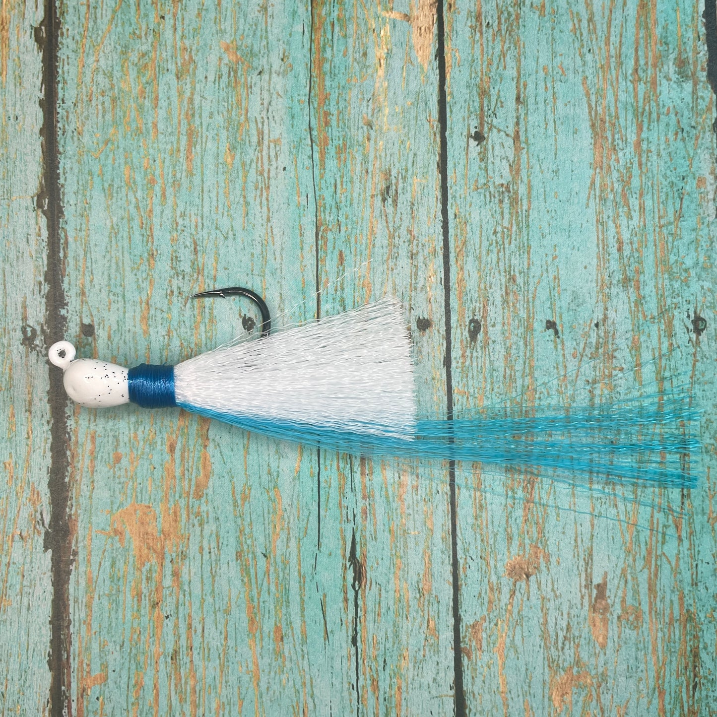 Mini Flare Hawk Jig. Peacock and Snook Candy