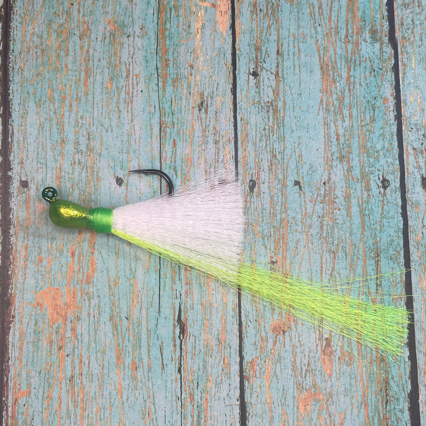 Mini Flare Hawk Jig. Peacock and Snook Candy