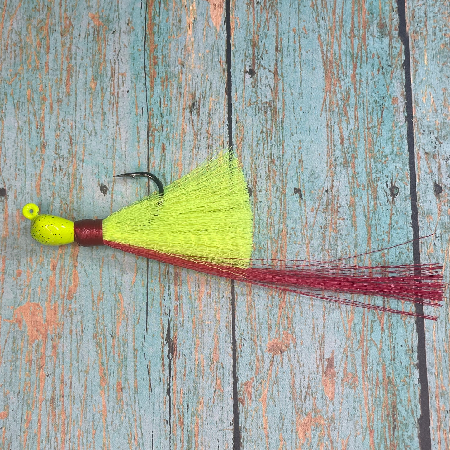 Mini Flare Hawk Jig. Peacock and Snook Candy