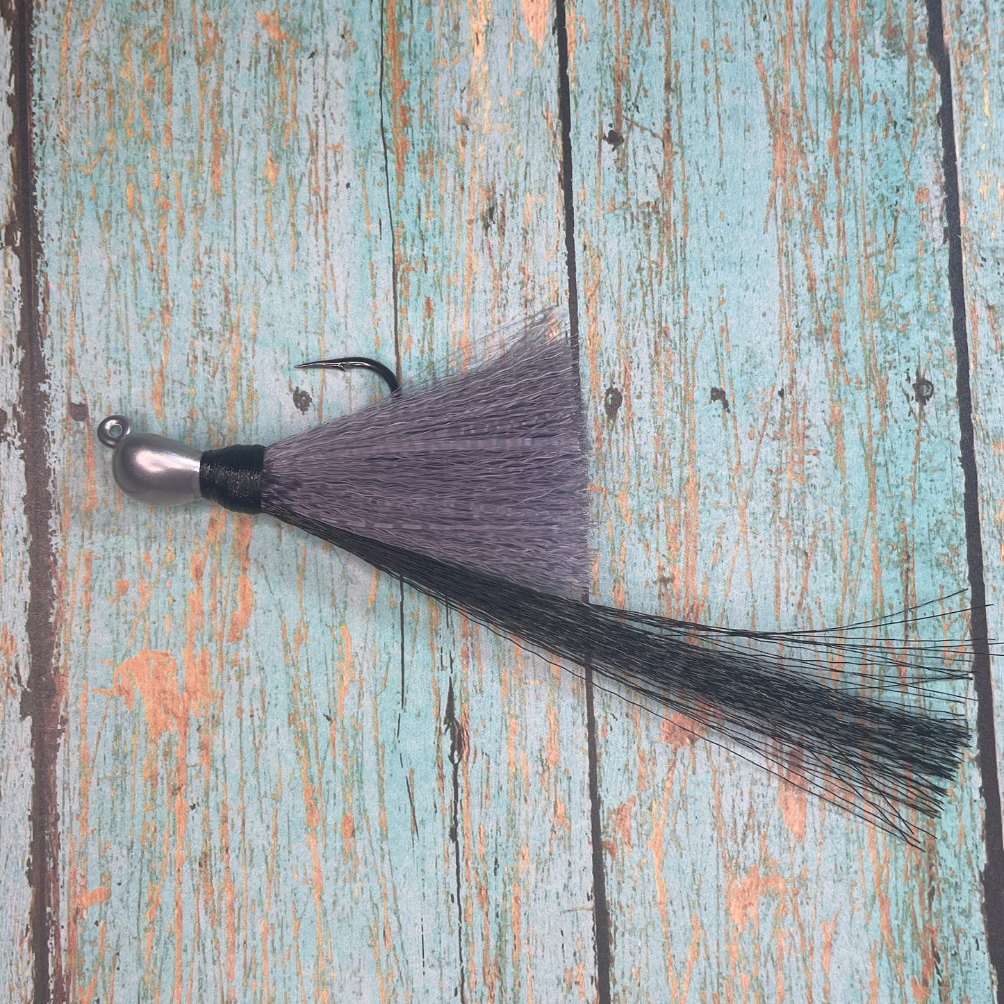 Mini Flare Hawk Jig. Peacock and Snook Candy