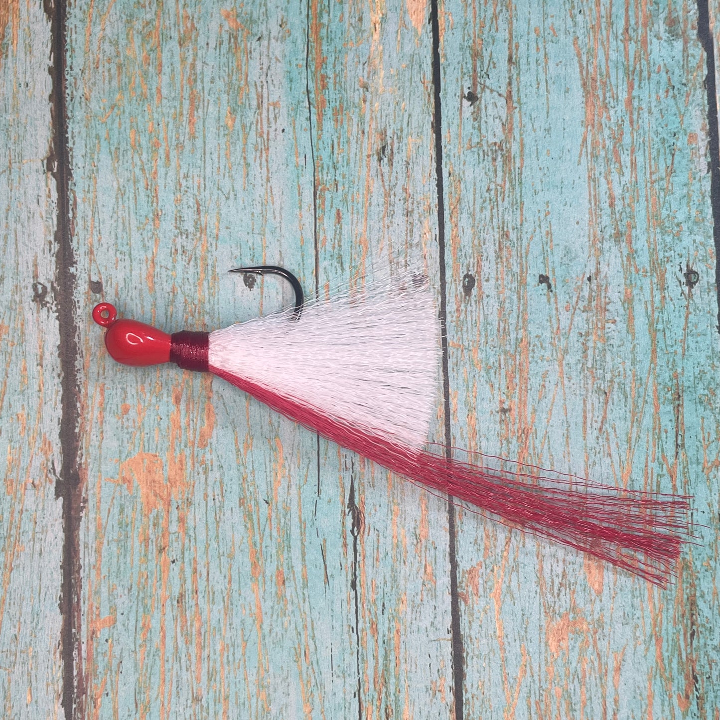 Mini Flare Hawk Jig. Peacock and Snook Candy