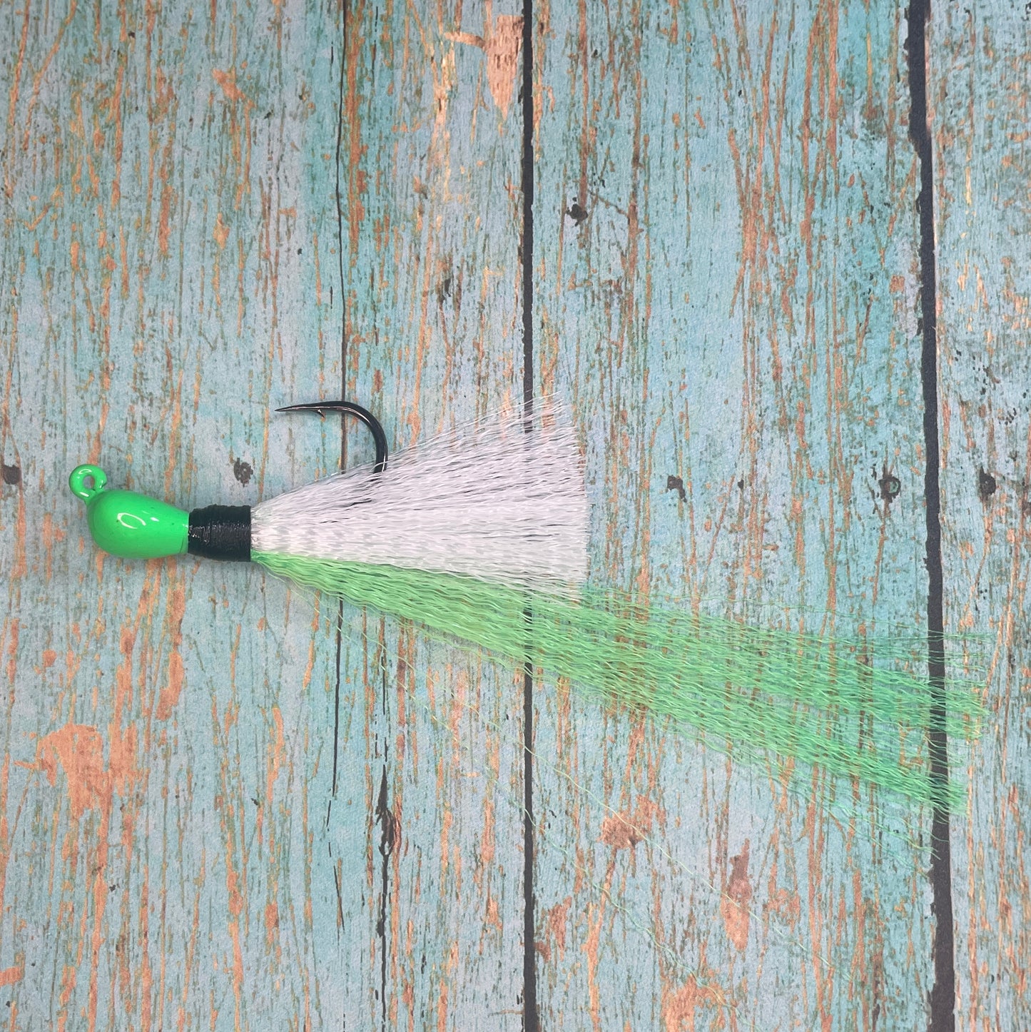 Mini Flare Hawk Jig. Peacock and Snook Candy