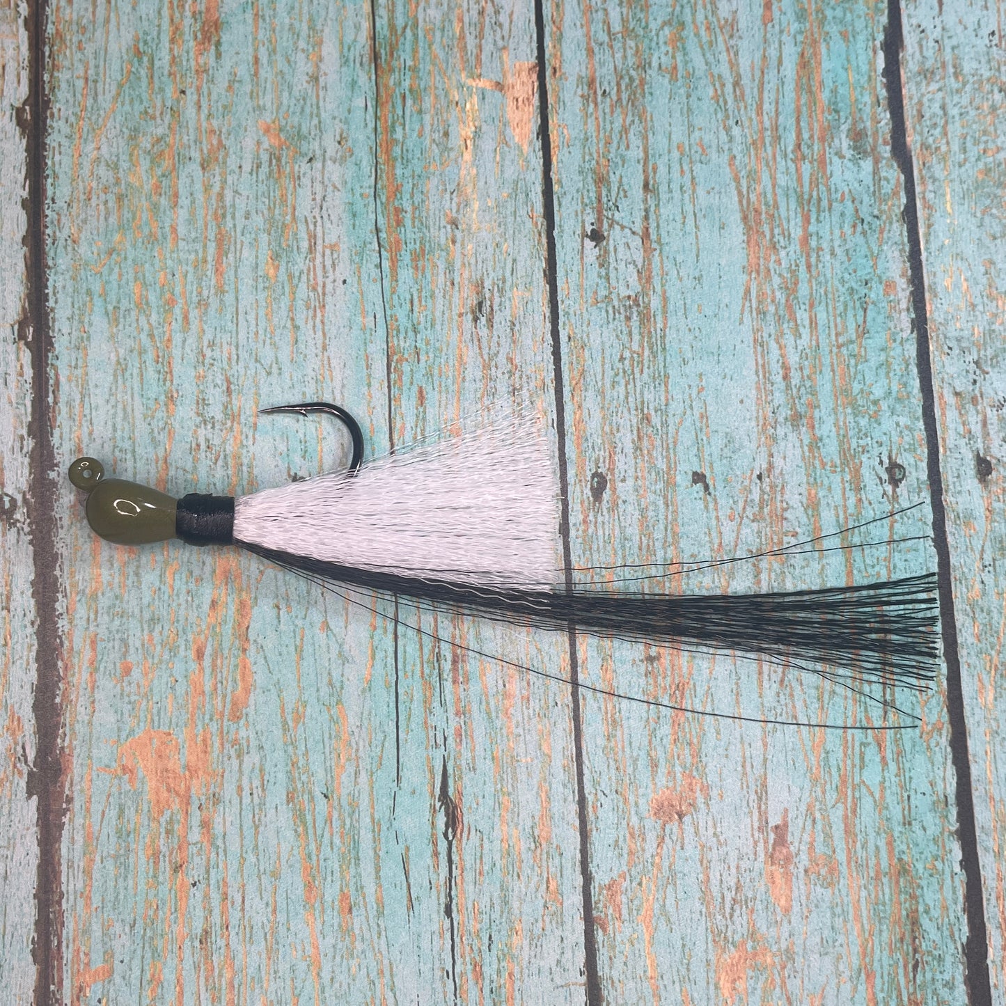 Mini Flare Hawk Jig. Peacock and Snook Candy